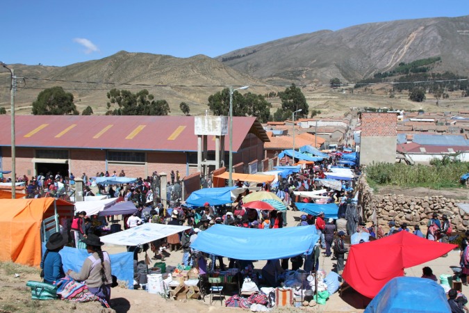 The crowded streets are abuzz with buying and selling, Tarabuco, Bolivia