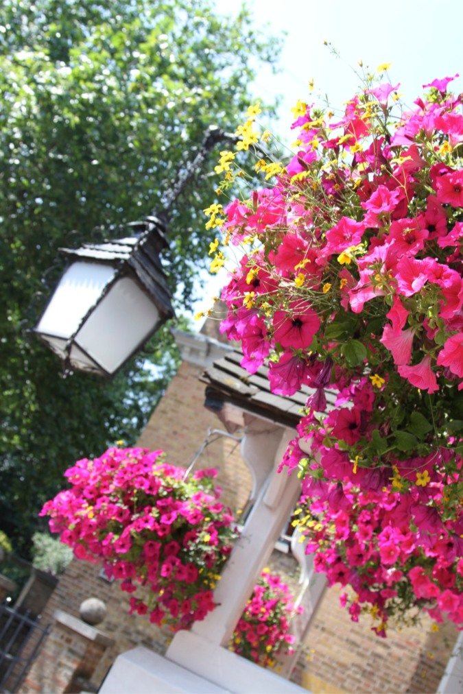Flowers and a light outside a pub in Highgate, London, England